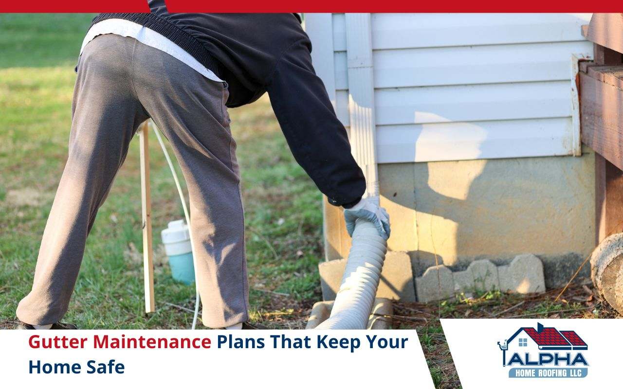 Professional checking downspout and fasteners during maintenance visit